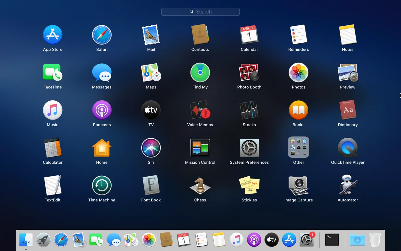 macOS Catalina sur la machine de référence : Launchpad : la grille des applications sur fond flouté
