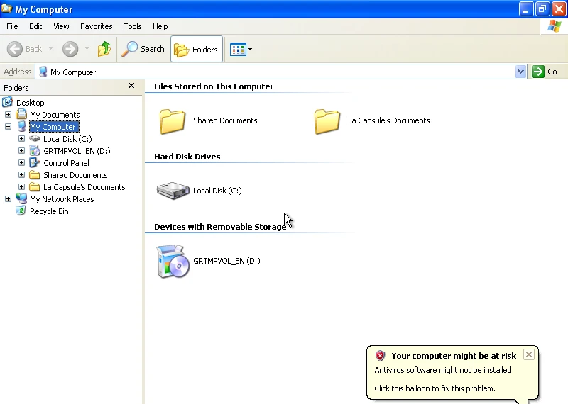 Windows 2000 sur la machine de référence : L'Explorateur (Poste de travail) : volet Dossiers, grandes icônes